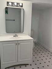 Bathroom featuring vanity and light floors