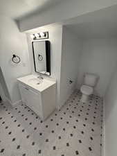 Bathroom featuring baseboards and vanity