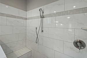 Bathroom featuring tiled shower