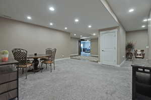 Dining room featuring light carpet and recessed lighting