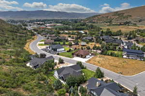 Aerial perspective of suburban area featuring a mountainous background