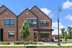 View of front of property with brick siding