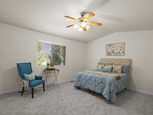 Carpeted bedroom with lofted ceiling and ceiling fan