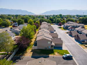 Aerial perspective of suburban area with a mountainous background