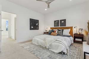 Bedroom featuring light colored carpet, recessed lighting, and ceiling fan