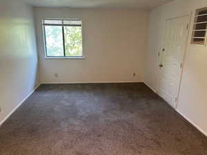 Spare room with carpet floors and baseboards