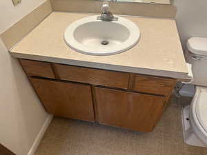 Half bath with toilet and vanity