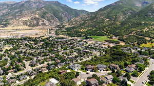 View of property location featuring a mountainous background and nearby suburban area