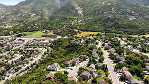 Aerial overview of property's location featuring a mountain backdrop