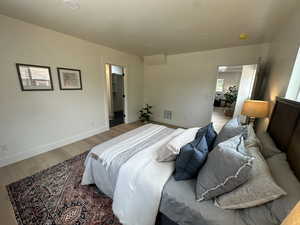 Bedroom featuring light wood finished floors and baseboards