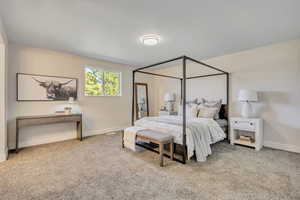 Carpeted bedroom with baseboards
