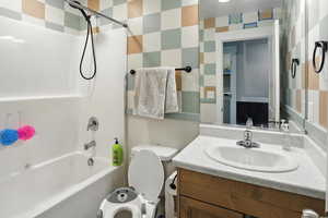 Full bath with bathtub / shower combination and vanity