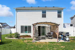 Back of house with a patio and a pergola