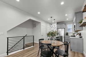 Dining room featuring recessed lighting and wood finished floors
