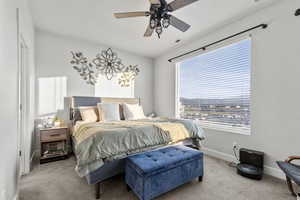 Bedroom featuring carpet and ceiling fan