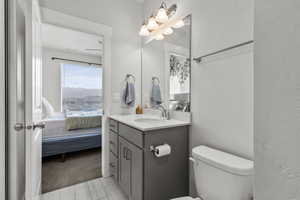 Ensuite bathroom with vanity and toilet