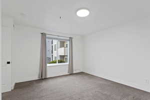 Main bedroom (bedroom 3) featuring carpet flooring and lots of natural light.