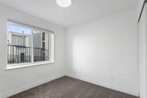 Bedroom 2 featuring carpet and natural lighting.