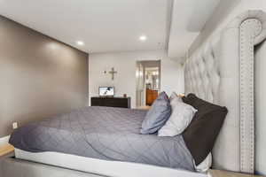 Bedroom featuring recessed lighting and ensuite bath
