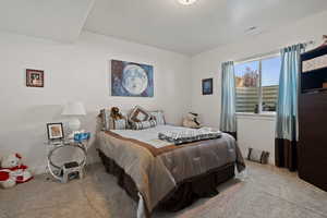 Carpeted bedroom with baseboards