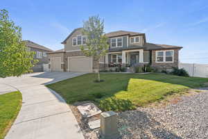 View of front of home with driveway, stucco siding, and an attached garage
