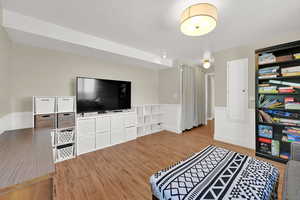 Bedroom with wood finished floors