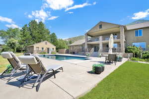 Outdoor pool with a patio area and a mountain view