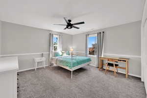 Bedroom with carpet flooring and a ceiling fan