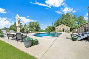 Swimming pool with a patio and stairs