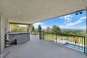 Patio / terrace featuring a hot tub and a patio