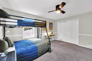 Bedroom featuring carpet and ceiling fan