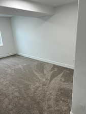 Unfurnished room featuring carpet floors