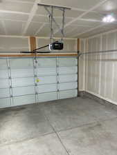 Garage featuring a garage door opener