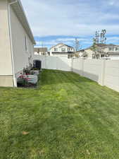 Fenced backyard with a residential view
