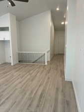 Unfurnished living room with light wood-style floors, ceiling fan, and recessed lighting