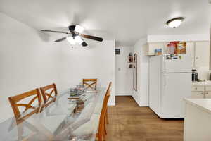 Dining space featuring light wood-style floors and a ceiling fan