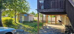 View of patio / terrace with a wooden deck and an outdoor structure
