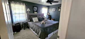 Bedroom with carpet flooring and a ceiling fan