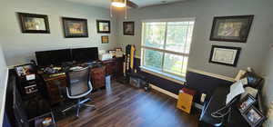 Office with baseboards and dark wood-style flooring