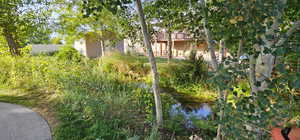 View of home's community with a water view