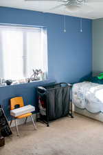 Bedroom featuring carpet and a ceiling fan