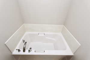 Bathroom with a large garden-style bathtub