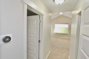 Entrance to the primary suite with a programmable thermostat.