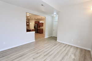 Lliving room with light wood-style flooring
