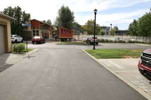 View from outside the garage toward the clubhouse and swimming pool.