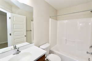 Full bath with vanity and bathtub / shower combination