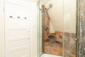 Full bathroom with a shower stall