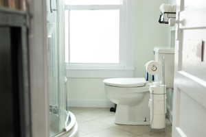 Bathroom with tile patterned flooring and toilet