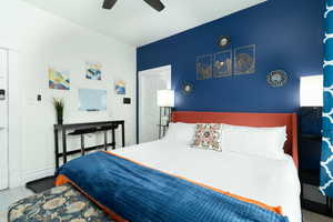 Bedroom featuring a ceiling fan and wood finished floors