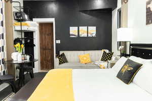 Bedroom featuring a textured wall